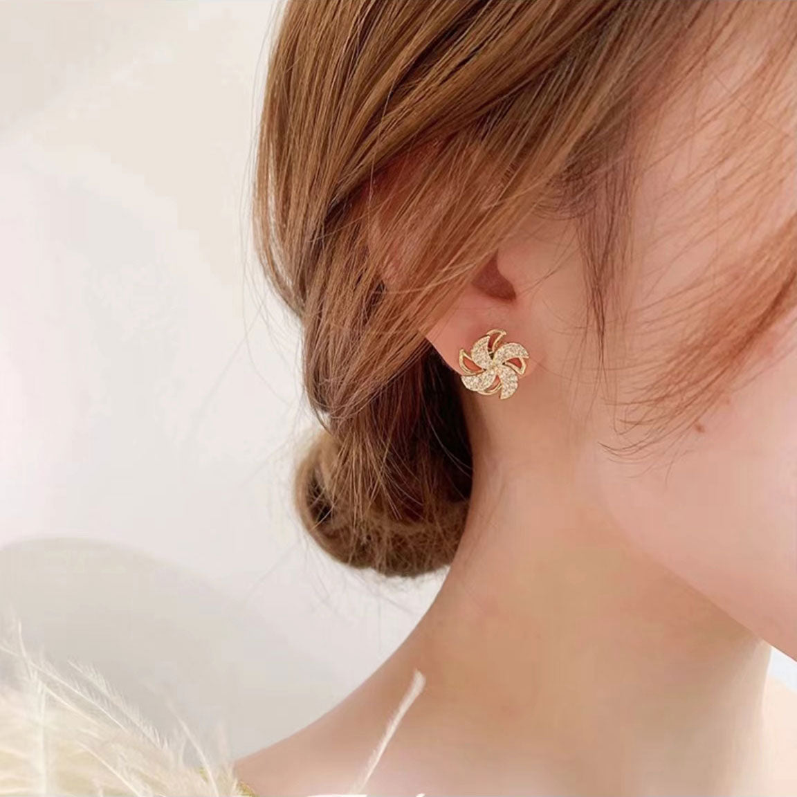 The windmill earrings will rotate.