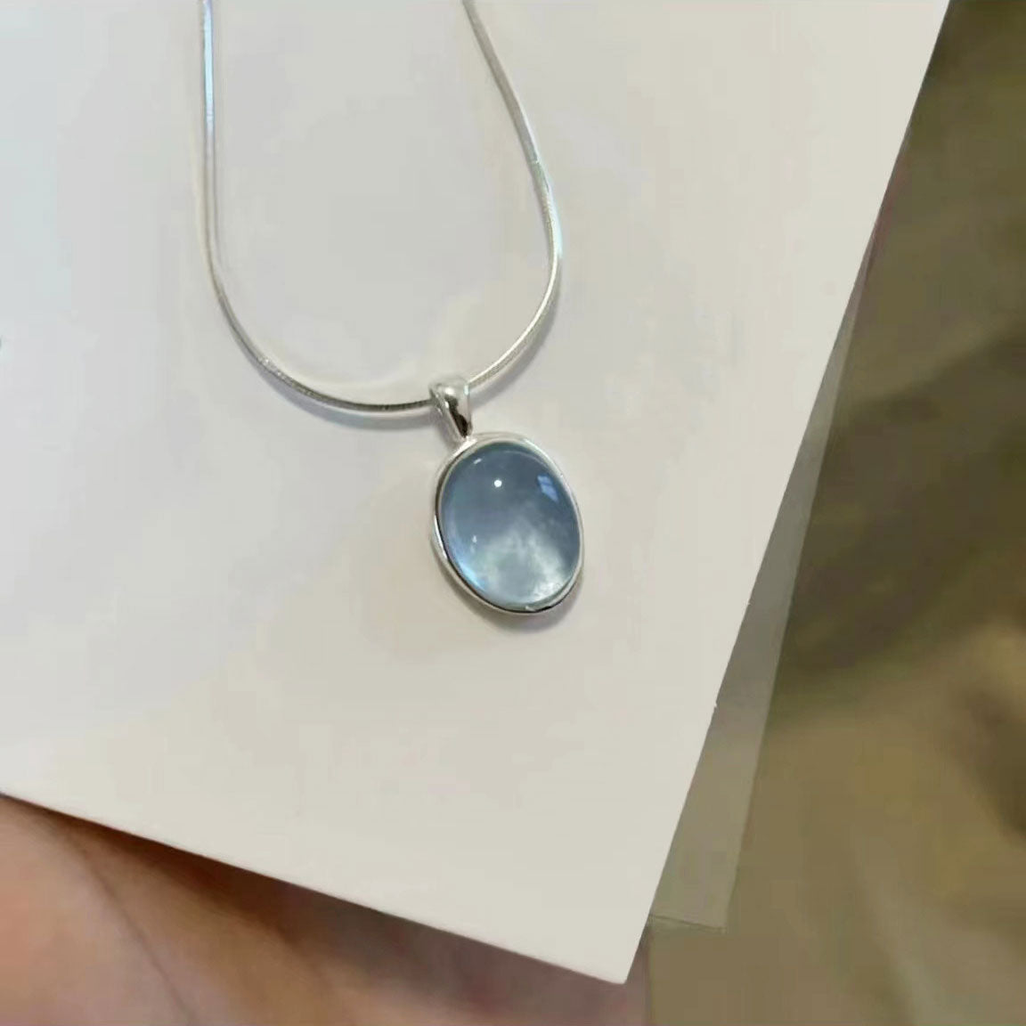 Clear oval sapphire necklace