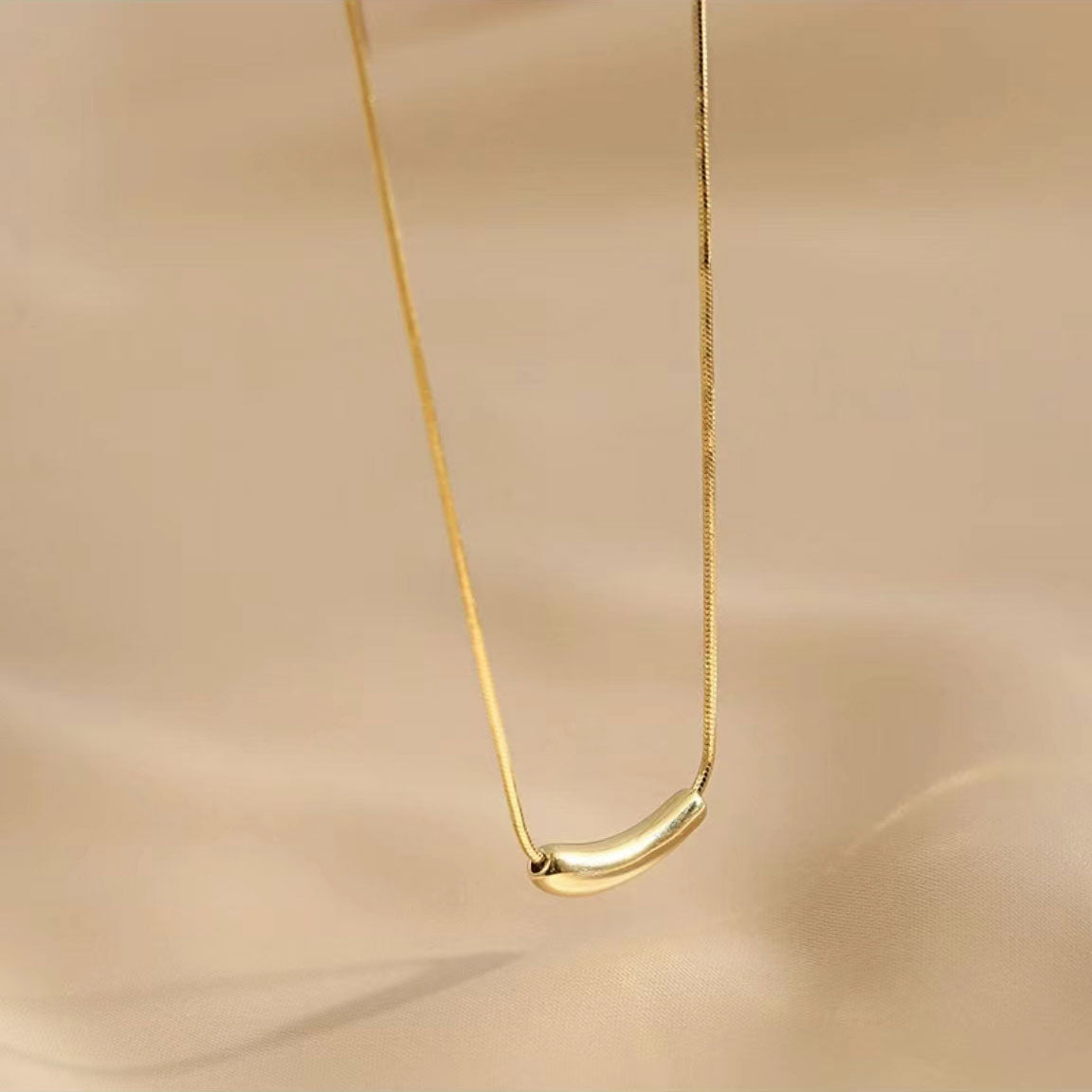 Gold "eggplant" necklace